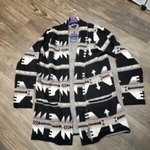 A black and white sweater with bears on it